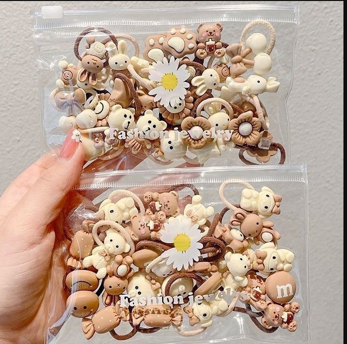 ミルクカレー色の子供の親指の髪輪赤ちゃんの髪ひもの髪飾り少女は髪ひもを刺して髪ゴムの髪飾りを傷つけない|undefined