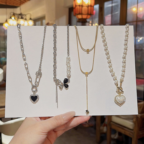 Korean new pearl necklace for women, versatile temperament, loving titanium steel clavicle chain, high-end design neck chain wholesale