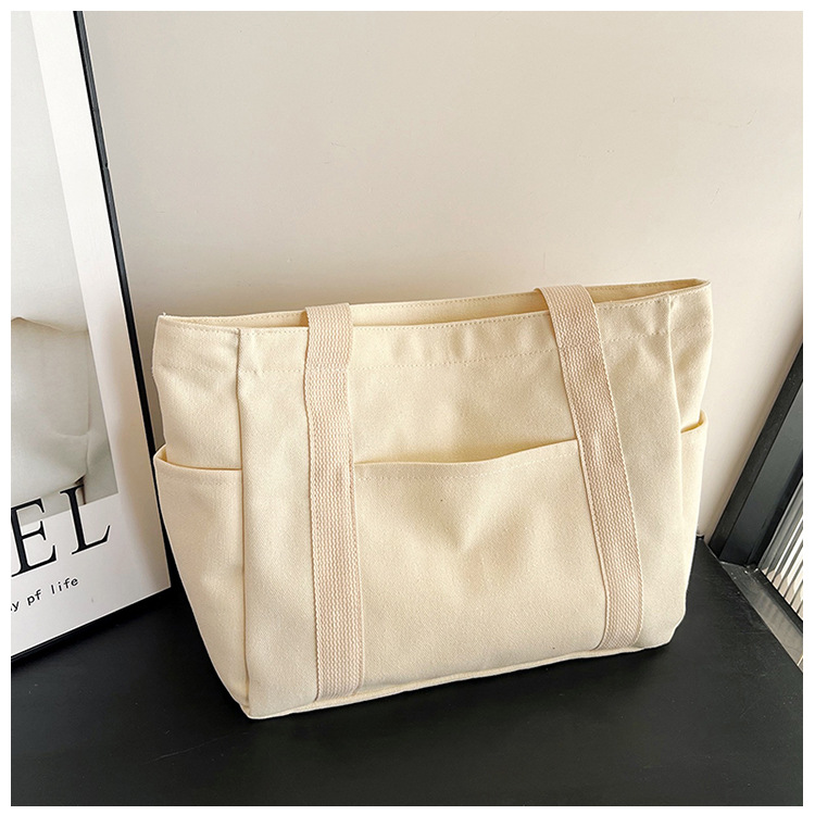 Wholesale of new women's single-shoulder bags, cross-border simple and casual canvas bags, Korean version LOGO printed commuter tote bags undefined