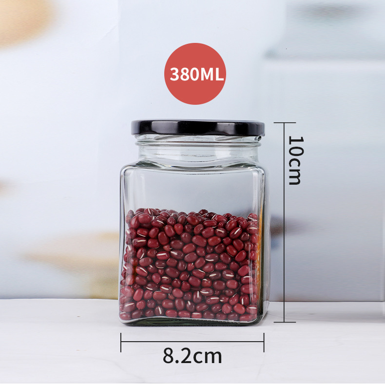 Suministro de botella de vidrio de cuatro bordes sellada transparente cuadrado multi-grano botella de almacenamiento puede botella de miel sub-botella al por mayor