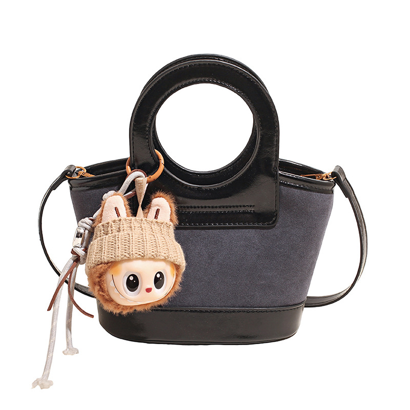 Bolso de mano coreano transfronterizo empalmado bolso de cubo de agua mujer otoño / invierno 2025 nuevo estilo de moda bolso de hombro bolso de viaje