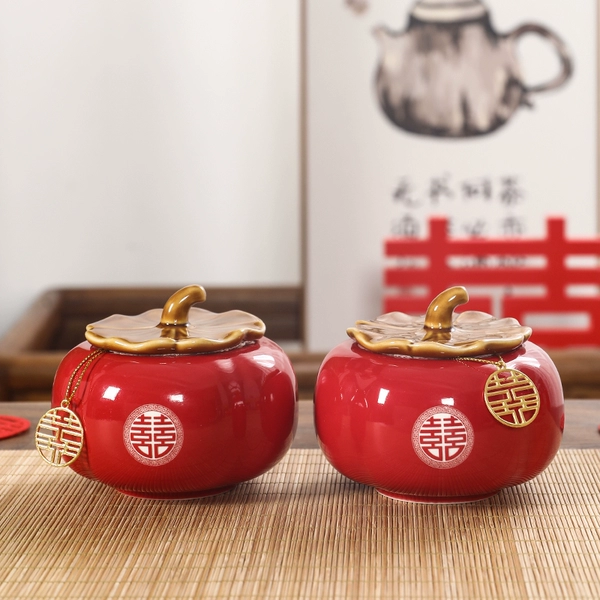 A pair of red persimmon jars