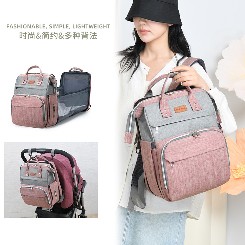 Nueva mochila de hombro de gran capacidad Baoma fuera de la bolsa de madre y bebé mochila de parto impermeable cama plegable bolsa de mamá