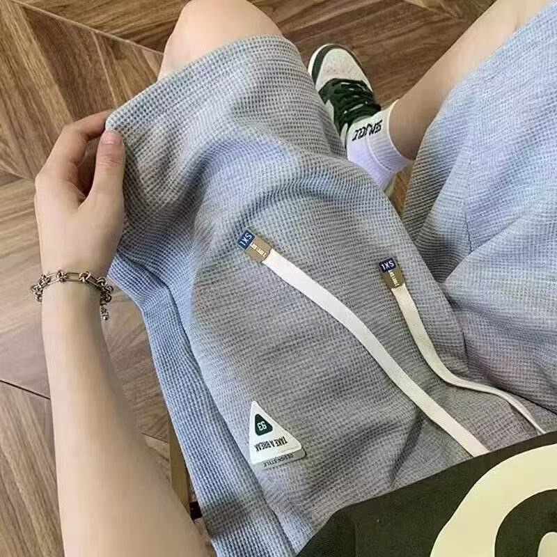 Diseño delgado nicho relajado de verano nuevo estilo americano pantalones cortos de moda hombre pantalones deportivos casuales de cinco puntos