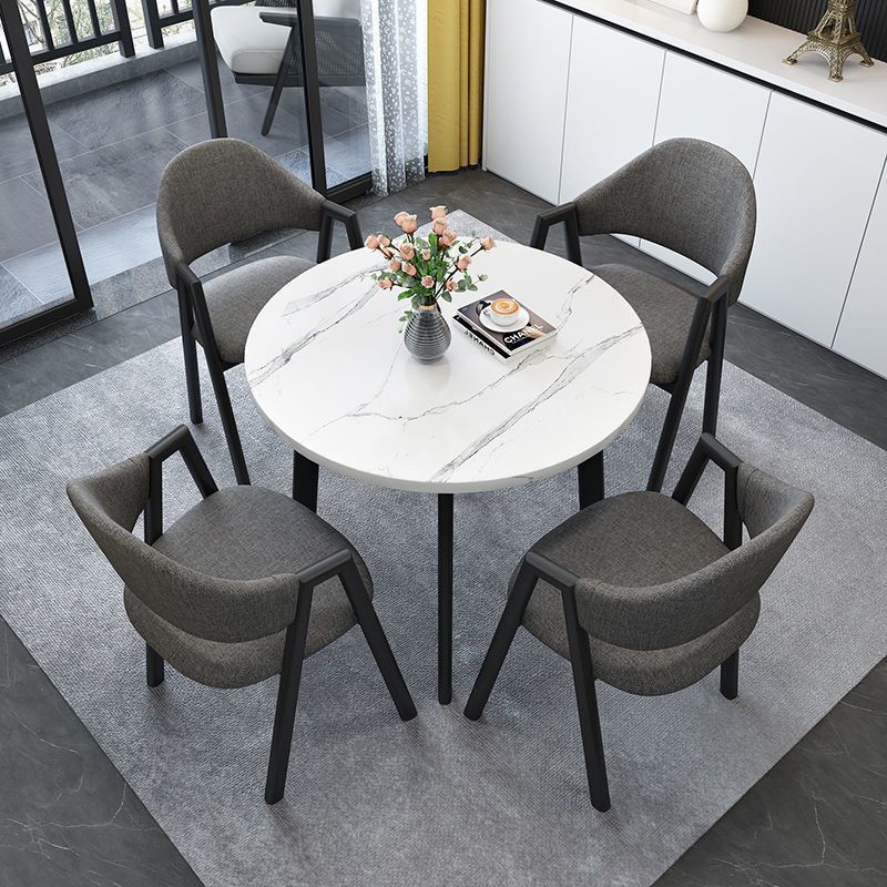Imitation white marble table + dark gray cloth chairs