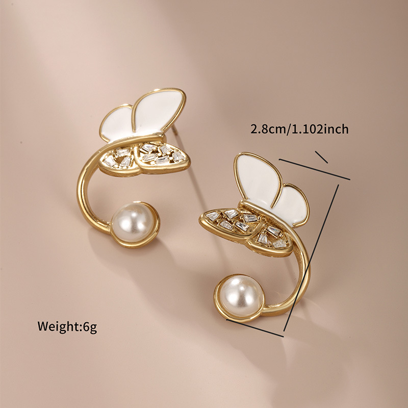 Xuping Jewelry Esmalte de goteo Pendientes de perlas de imitación de mariposa Pendientes de temperamento de diseño de nicho de alta gama de estilo coreano
