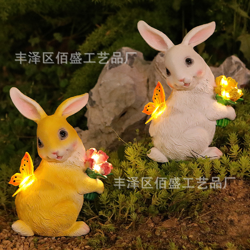 Decoración de jardín transfronteriza abraza flores mariposas conejos adornos animales al aire libre lámpara solar artesanías de resina