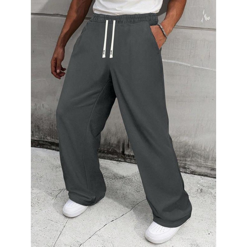 Pantalon de survêtement homme uni à jambes larges, coupe ample et décontractée, cordon de serrage, style sportif, jambes droites._voghion.com