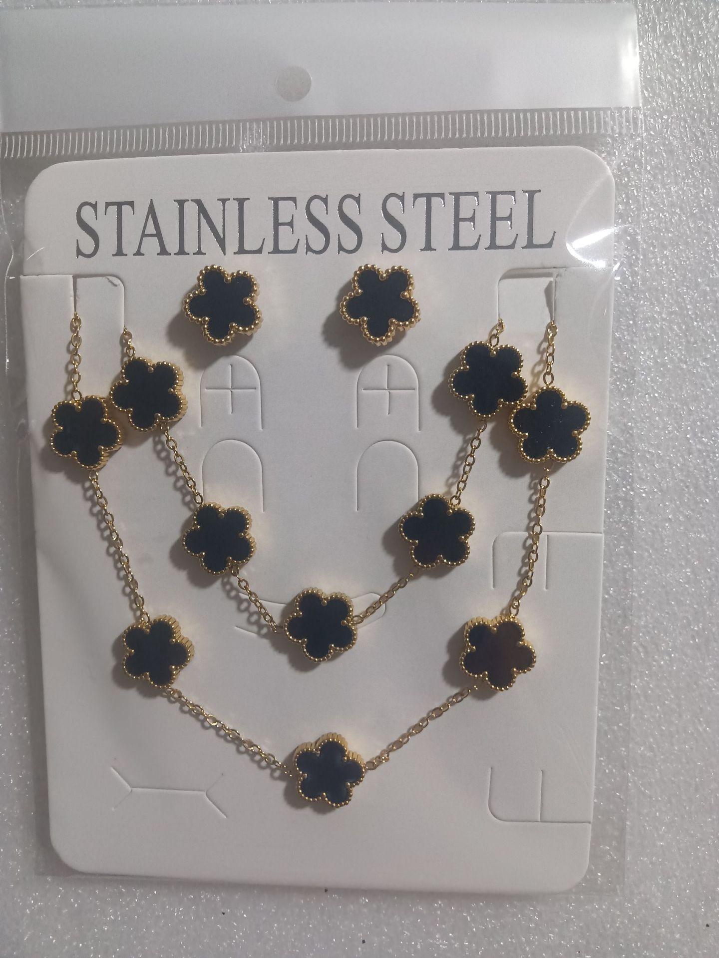 Trébol de cinco hojas de la suerte nuevo estilo transfronterizo pulsera de acero de titanio de doble cara, collar, aretes, moda de nicho de 18K, no se desvanece