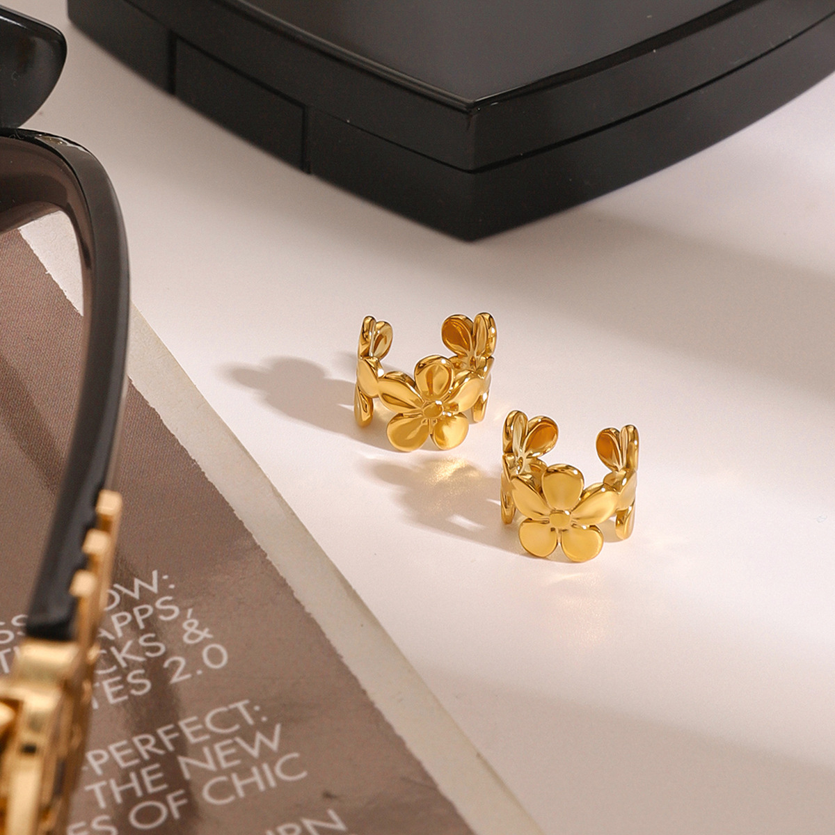 JEDING Europa y América, pendientes de flores de acero inoxidable, pendientes de acero sin agujeros de orejas, pendientes transfronterizos.