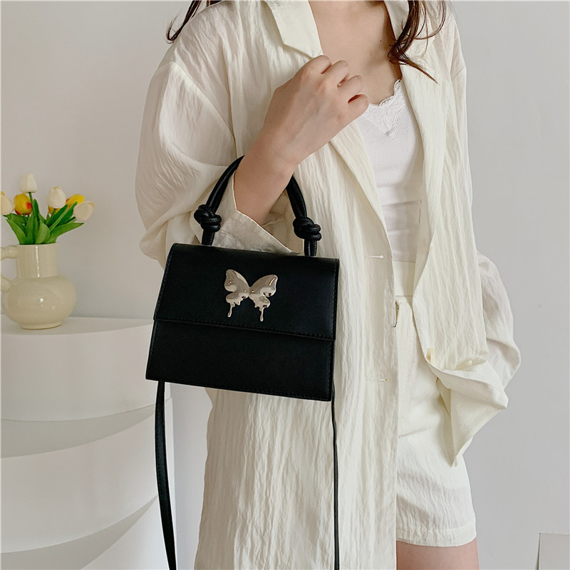 Diseño de nicho de lujo ligero bolso de mano de este año popular arco decoración de viaje diario mochila de hombro para mujeres