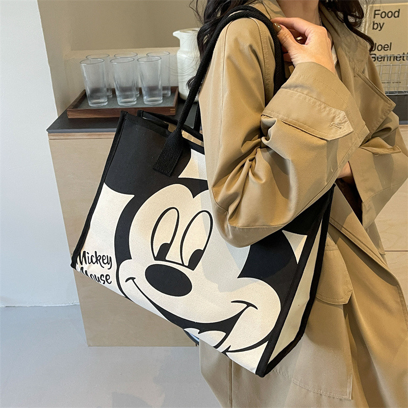 2024 bolsa de lona de las mujeres de primavera nueva moda bolsa de hombro de gran capacidad bolsa de viaje portátil de dibujos animados bolso de la momia