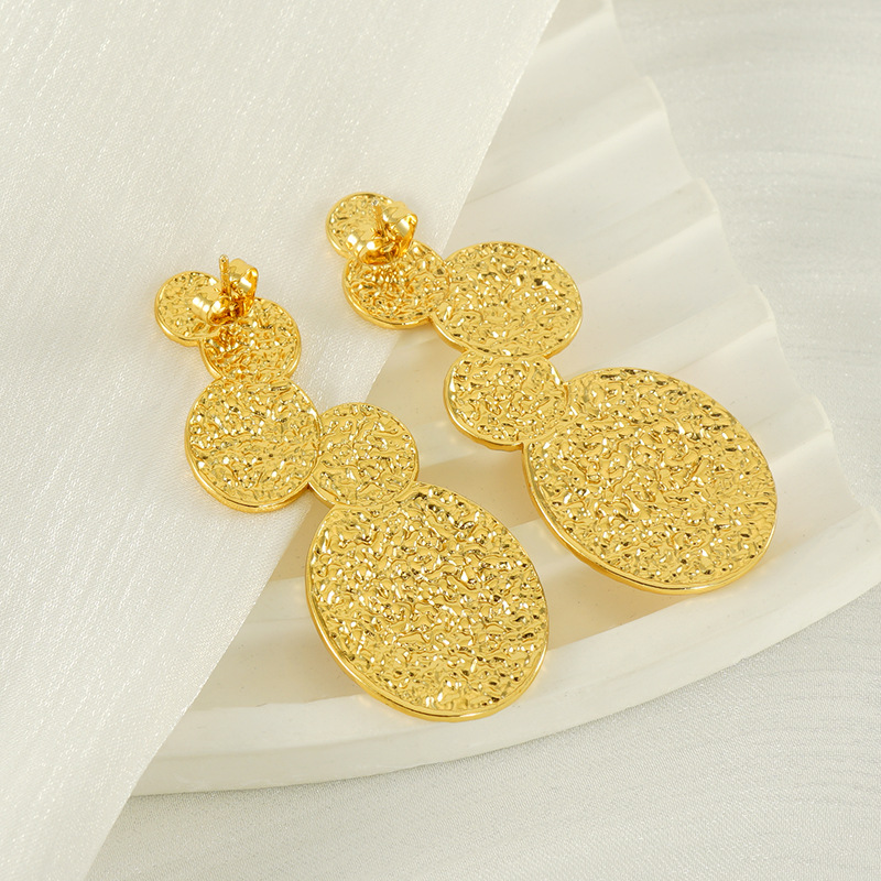 Diseño transfronterizo europeo y americano, pendientes de acero de titanio de moda chapados en oro de 18 quilates de acero inoxidable de lava INS viento