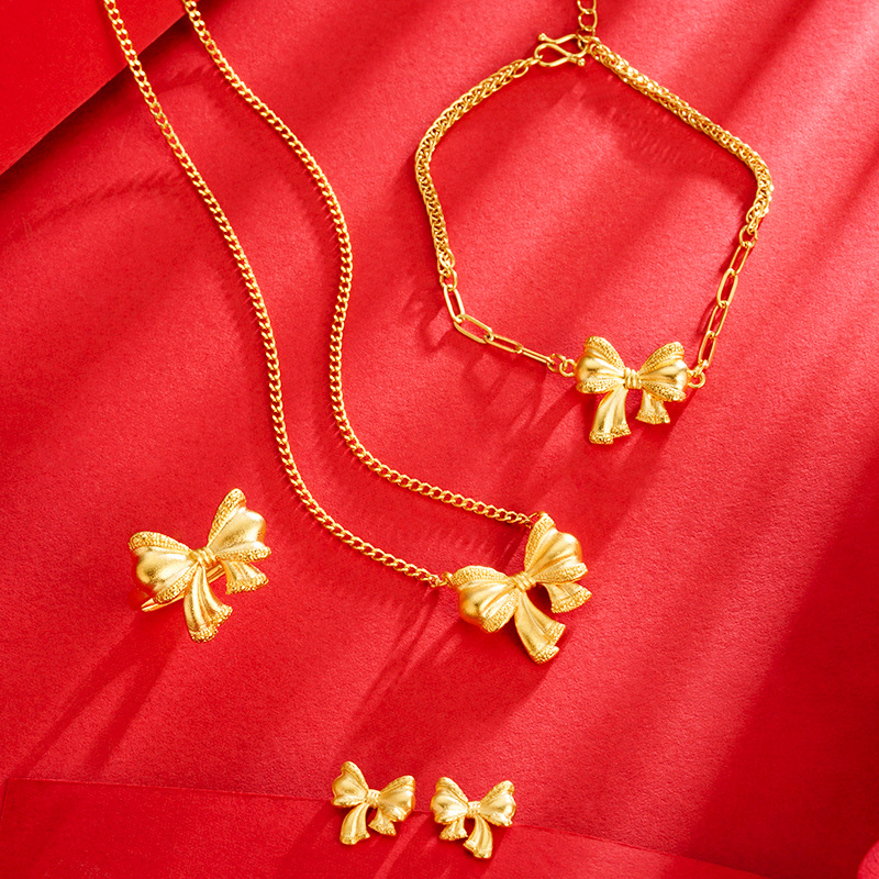 Moda arco collar femenino oído espárragos orquídea anillo mariposa pulsera dulce todo partido pequeño libro rojo mismo estilo de suministro