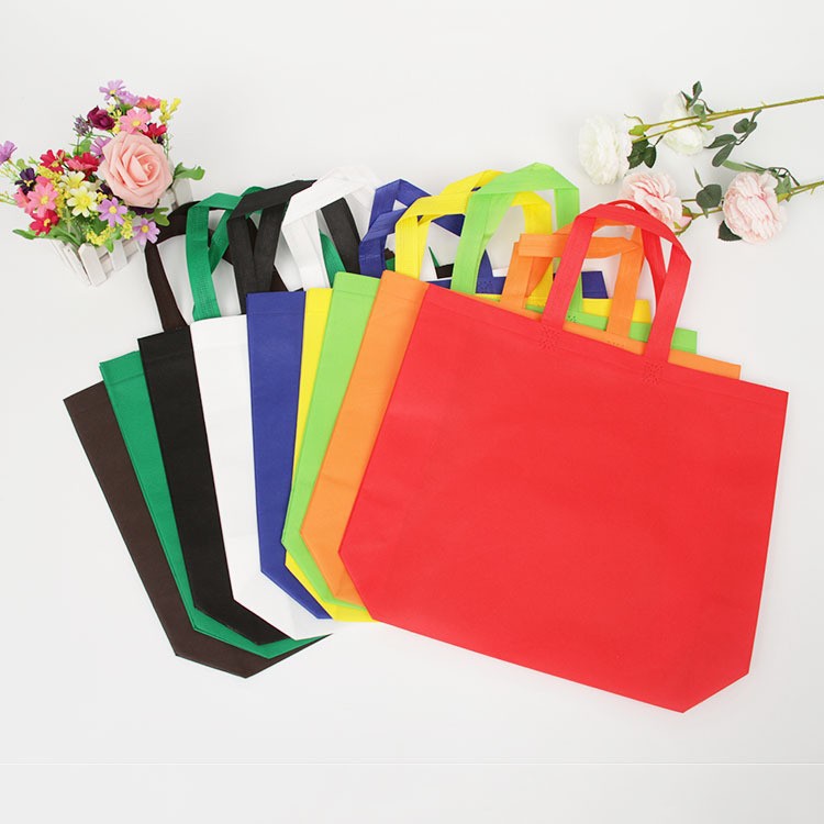 Bolsas de tela no tejida de gran tamaño recubiertas de película de mujer en stock bolsas de compras prensadas en caliente fijas pueden imprimir bolsas de publicidad LOGO