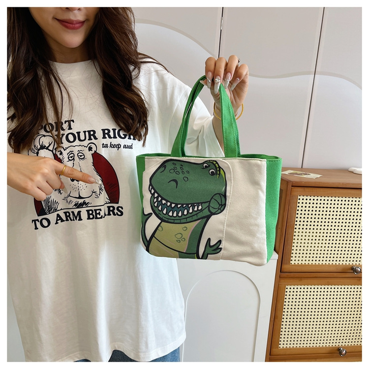 Cute cartoon printed small bag, 2024 summer new style hand-held piggy girl handbag, student storage canvas bag undefined