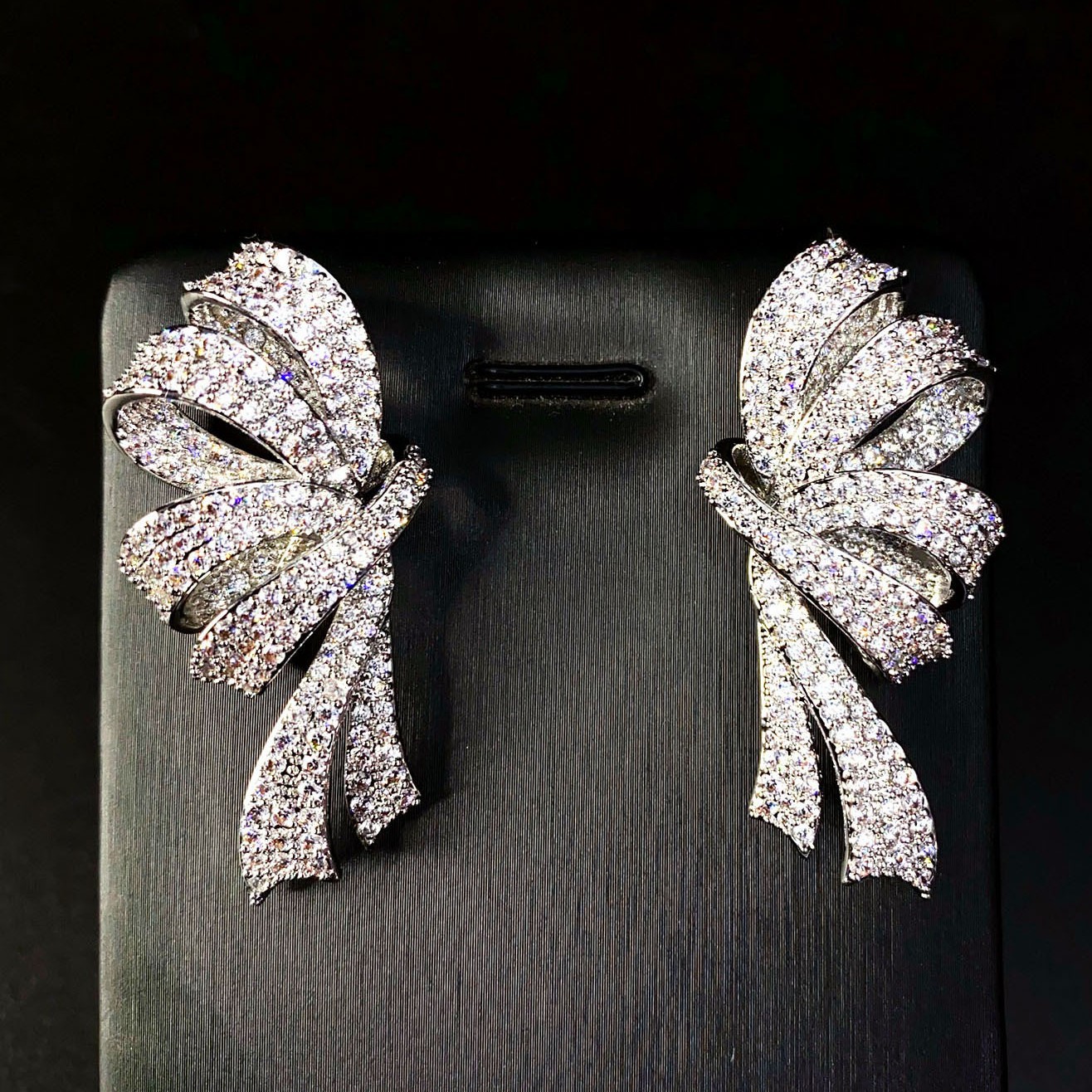 Sophisticated elegant three dimensional cute earrings with bow