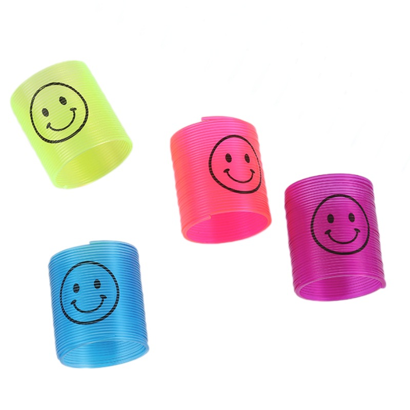 Nuevo 3.2 * 3.5cm sonriente transparente pequeño arco iris bobina de plástico para niños juguetes plegables
