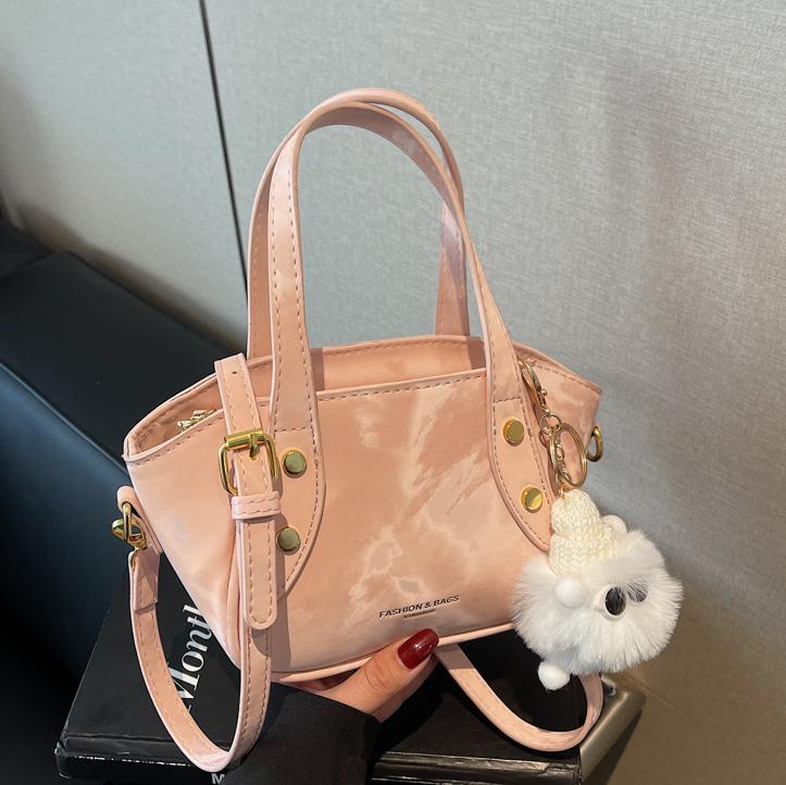 Nicho de diseño de tendencia bolso de cubo de mano mujer 2025 nueva moda bolso de hombro de estilo extranjero para trabajar bolso de transporte