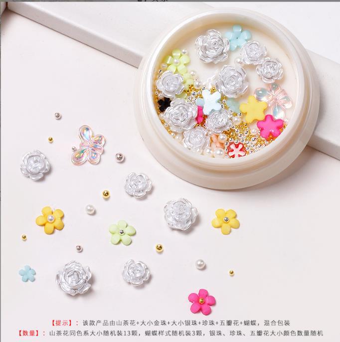 Nueva celebridad en línea suministros de uñas 3D multicolor de alto grado Camelia mariposa cinco pétalos flor bola de acero joyería de uñas diamante