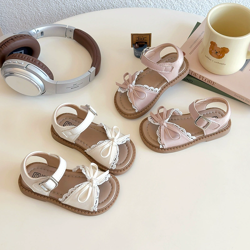 Девушка балетный стиль принцессы обувь 2025 лето новый детский бант мягкая подошва пляжная обувь модные детские сандалии