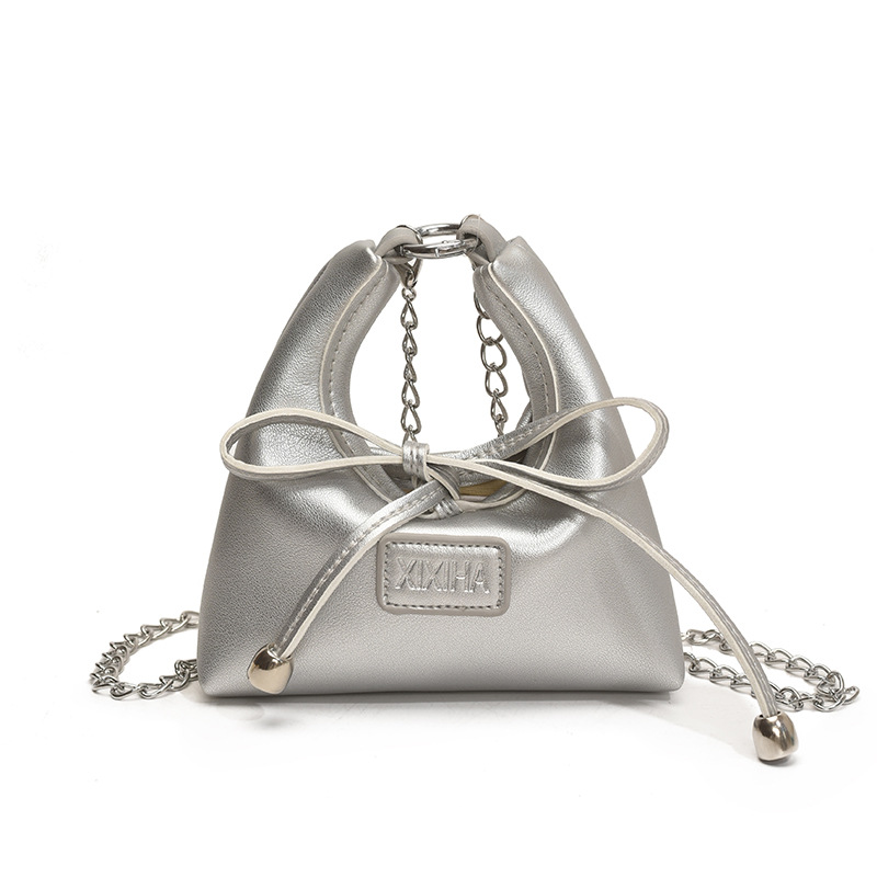 Bolsa de tendencia coreana para niñas, mini bolso de mano simple de color sólido, bolso de accesorios para niños de arco lindo