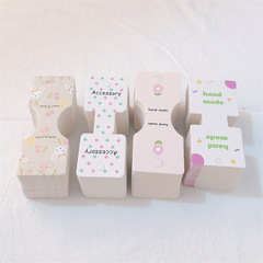 Korean Dongdaemun-style hair ties with card packaging, featuring Korean text—hair clips, hair accessories, earrings, and ear studs; also available as a dual-purpose cardboard hairband.