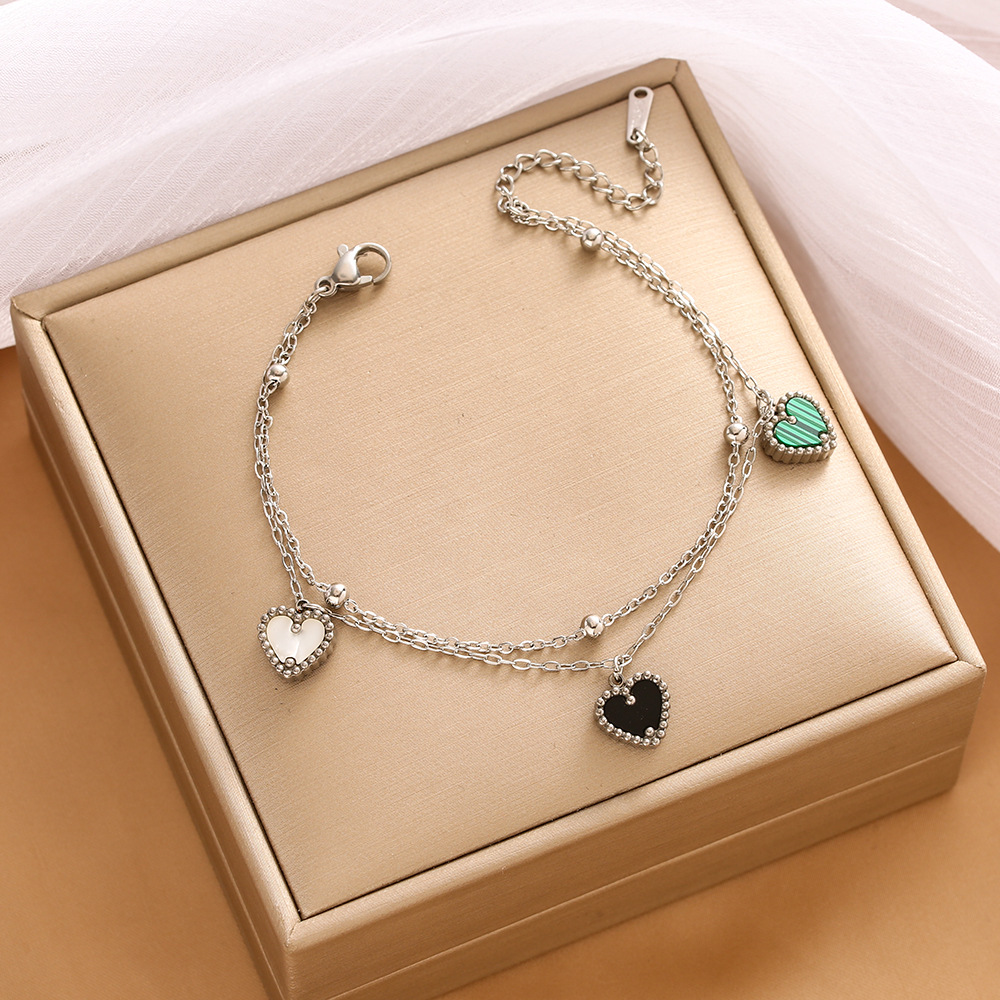 Pulsera de trébol de acero titanium vendedora caliente transfronteriza europea y americana con incrustaciones de concha pulsera colgante pulsera de diseño avanzado sin desvanecimiento al por mayor