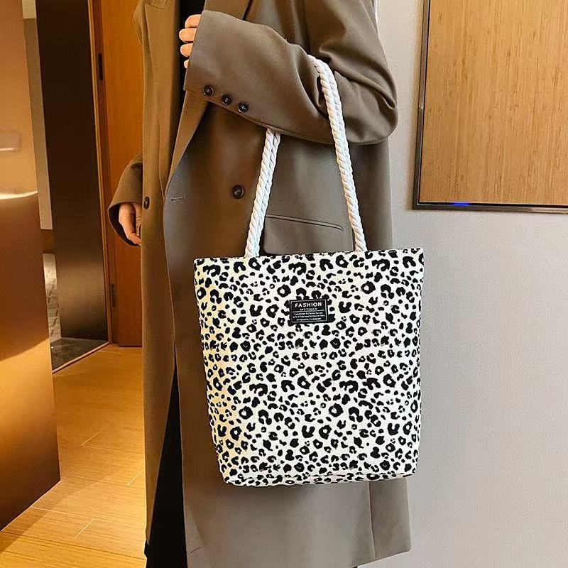 Bolso de mujer 2026 nueva impresión bolso de lona de moda leopardo coreano bolso de gran capacidad bolso de hombro de mano de compras