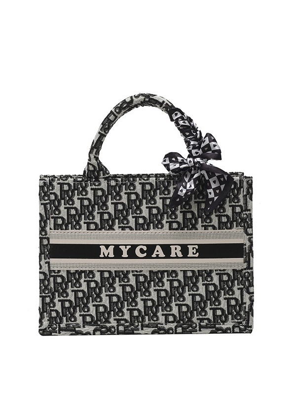 Bolsos bordados de alta calidad para mujeres 2026 nuevas letras de tela transfronterizas retro bolsas de mano de transporte de gran capacidad