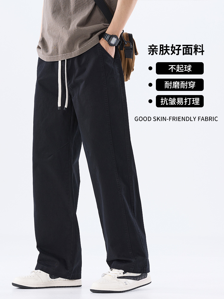 綿のカジュアルなズボンの男性のストレートのゆったりしているズボン2025夏の薄いタイプのファッションの防風傘兵の広い足のズボンの男性