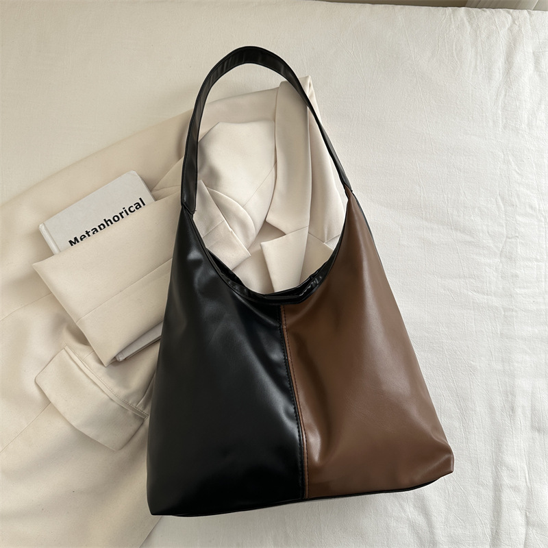 Bolsa de mujer de gran capacidad, textura de 2024, nueva moda simple, bolsa de hombro universal, bolsa de brazo de viaje de color.