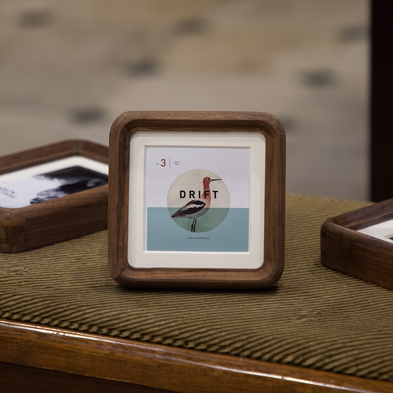 Wall photo frame from natural wood rounded