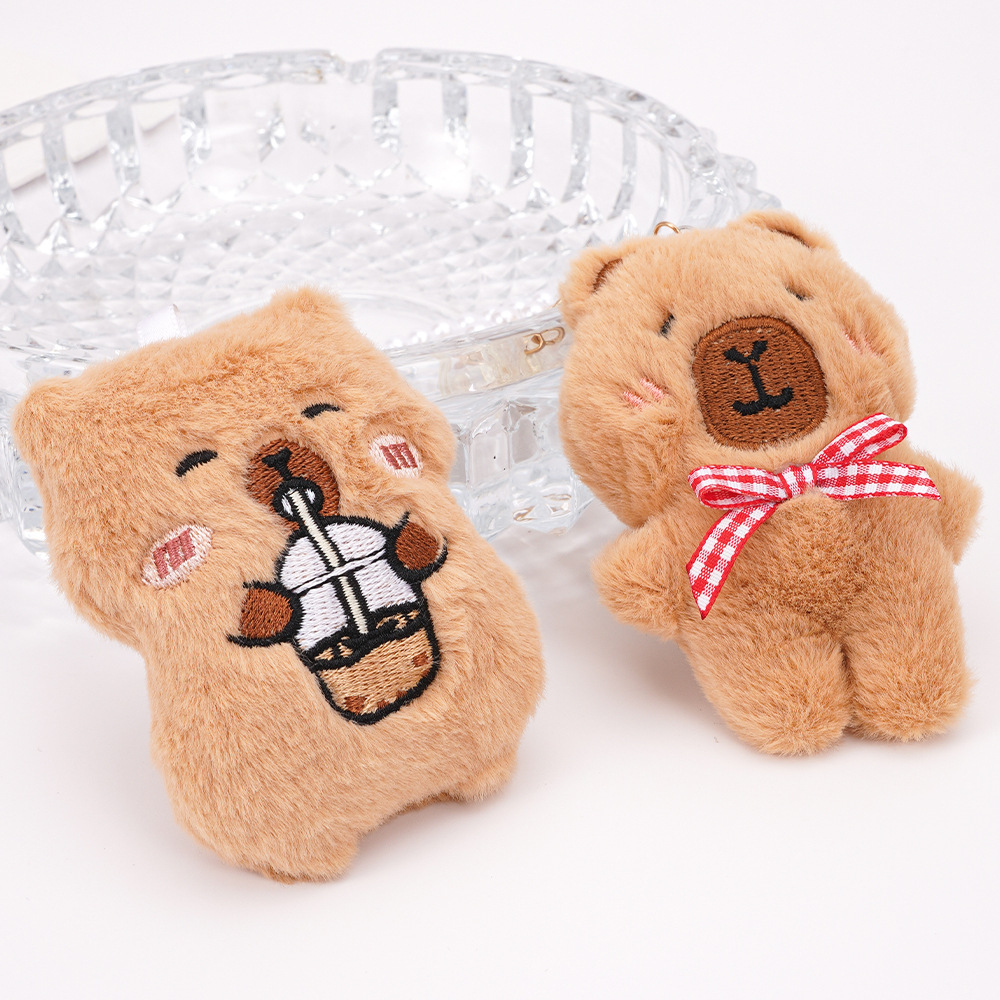 Colgante de bolso de animal de dibujos animados lindo Kapibala niña mochila llavero accesorios colgantes de perlas de felpa