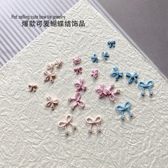 かわいいマカロン配色真珠蝶ネクタイ合金ネイルアクセサリー塗装リボンリボンdiyネイルドリル