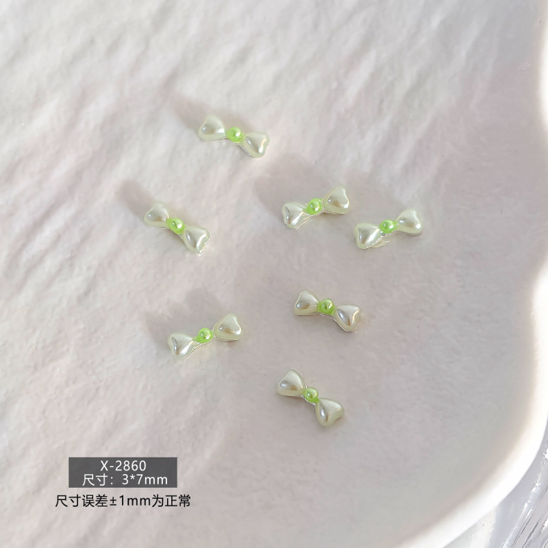 春日甜美简约日韩风珍珠蝴蝶结立体树脂美甲饰品爆款多色系指甲钻|undefined
