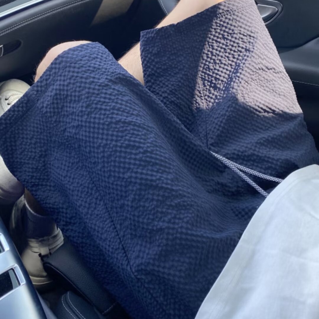 Pantalones cortos de secado rápido a cuadros de burbujas para hombres verano nuevo estilo pantalones de playa de color sólido tendencia americana pantalones delgados de cinco puntos