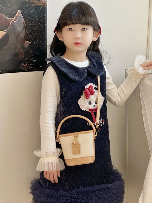Mini pequeño bolso de cubo de mano para niños 2026 nuevo estilo de alta calidad de moda versátil bolso de mochila de estilo exterior
