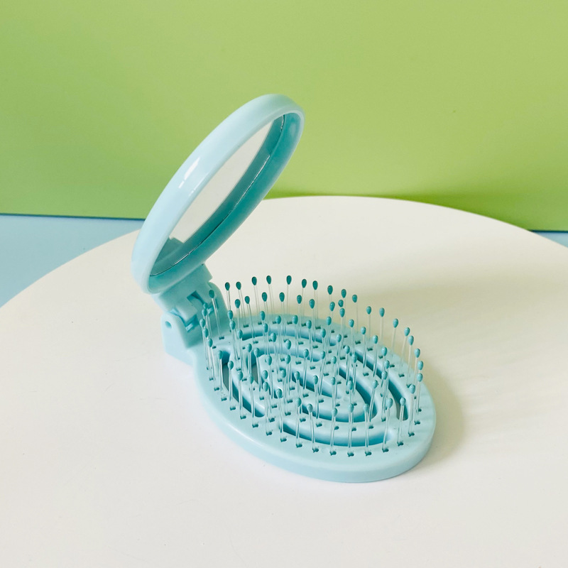 Hogar portátil de viaje cojín de aire peine hueco plegable masaje peine mini hueso contar peine pequeño con espejo al por mayor