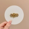 Golden brace, flowered