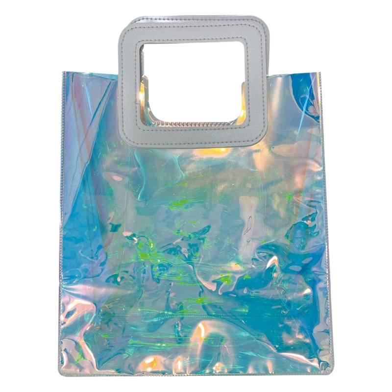 Bolsa de mano transparente de PVC, bolsa de regalo de plástico, bolso de mano láser, bolsa de regalo transparente en stock, proceso láser