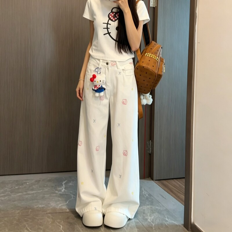 Age-reducing, slimming, and versatile white embroidered jeans for women, featuring cute cartoon patterns, a high waist, wide legs, and a slimming, straight-leg design