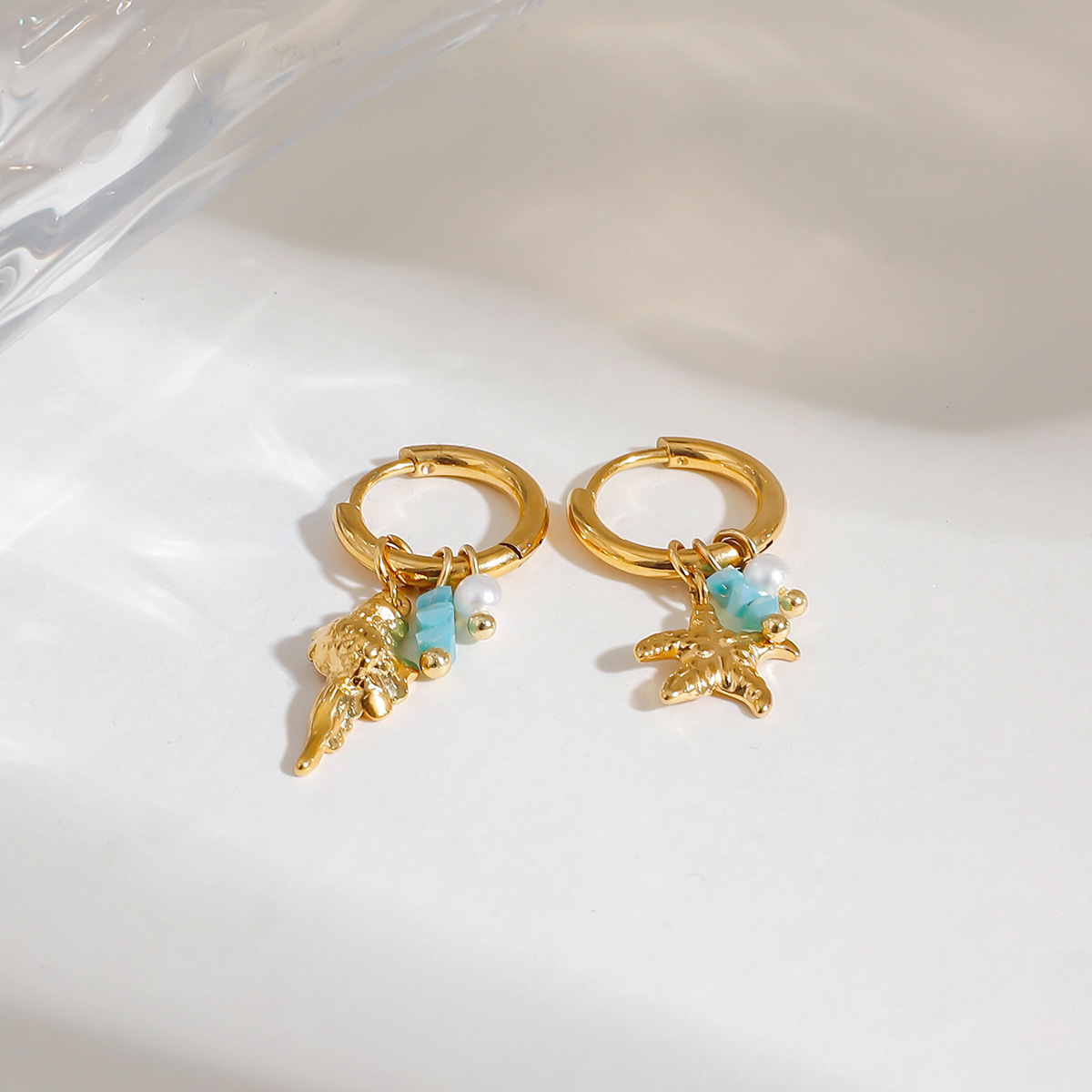 Wanxing Europa y los Estados Unidos de perlas de piedra triturada estrella de mar colgante de rosca de aretes de estilo marino estilo universal aretes de acero inoxidable transfronterizos