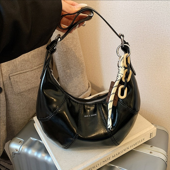 Transfronterizos coreanos perezosos bolsas de brazo de cera nicho bolsas de cuerno de piel de cera 2026 nuevas bolsas de brazo diarias mujeres