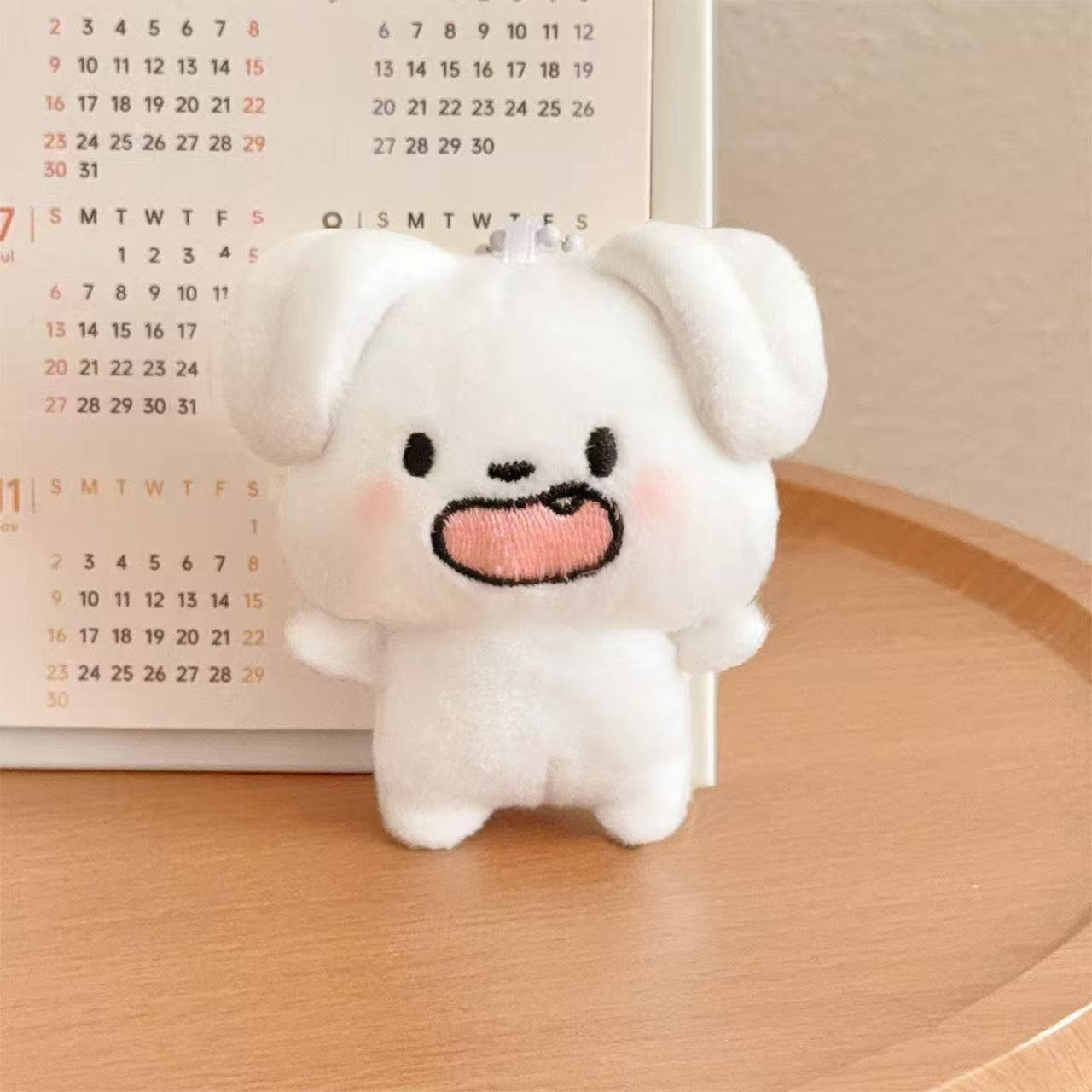 The new plush dog eye pendant is a cute little dog bag accessory, abstract and exquisite, suitable for both male and female students