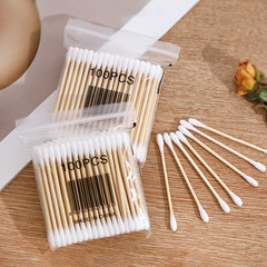 使い捨てのきれいな綿棒の木の棒の綿棒の化粧を落とします。