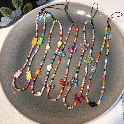 Korean version of the new ins style colorful rice beads beaded mobile phone chain ins fashion bear love flower bow tie pendant for women