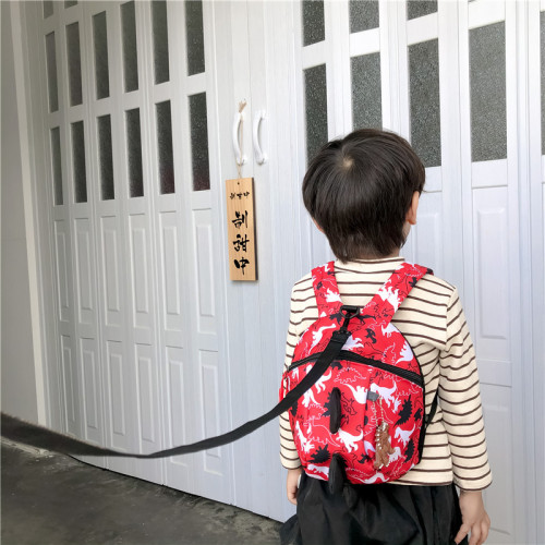 Children's schoolbag boy's cute dinosaur print backpack Korean version foreign trade new kindergarten primary school student anti-lost bag
