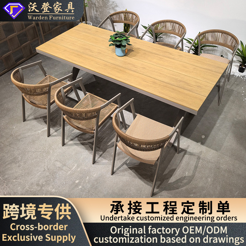 New cross-border rattan outdoor faux-wood tables and chairs for open-air courtyards, hotel projects, modern minimalist combination furniture wholesale New cross-border rattan outdoor faux-wood tables and chairs for open-air courtyards, hotel projects, modern minimalist combination furniture wholesale