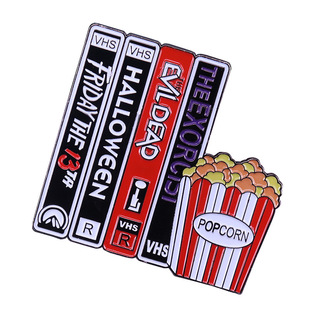 Vintage video VHS and popcorn brooch horror movie badge